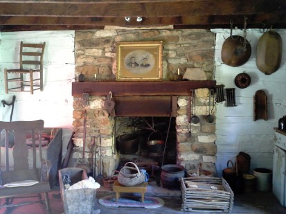 The fireplace in the cabin. On the mantel is the wedding portrait of Jacob and Catherine Dietrich.
